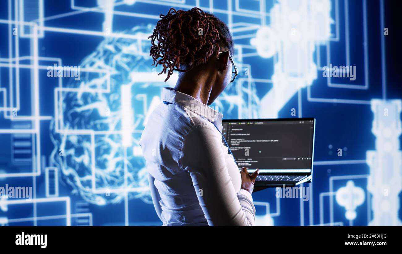 Supervisor overseeing data center updating hi-res stock photography and ...