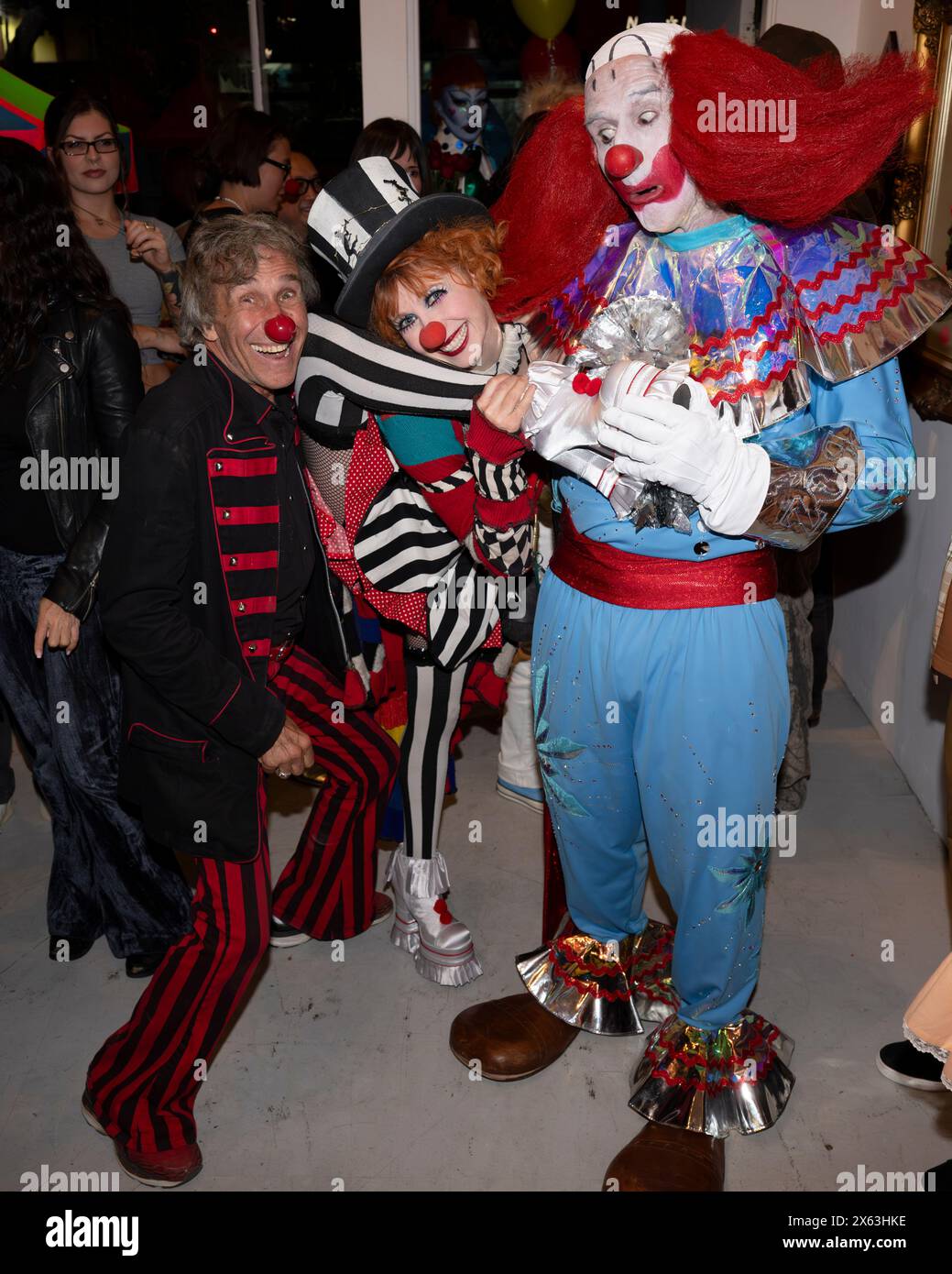 May 11, 2024, Hollywood, California, USA: Gary Morgan, Bonnie Morgan and Bozo the Clown, aka, David Arquette attend ''BONKERS'' the Art Show. (Credit Image: © Billy Bennight/ZUMA Press Wire) EDITORIAL USAGE ONLY! Not for Commercial USAGE! Stock Photo