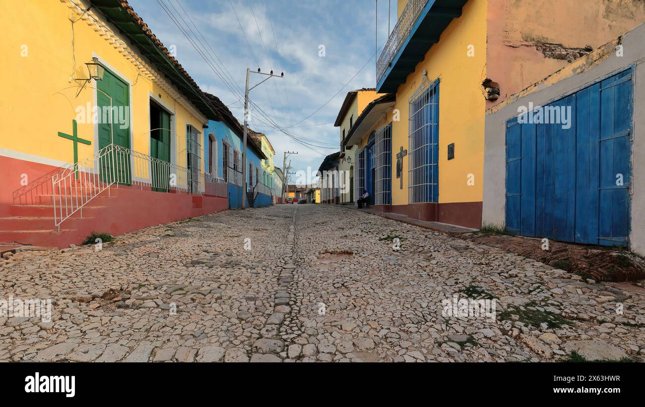 271 Colorist colonial houses on both sides of the cobbled sloping Calle Amargura Street, up to the junction with Calle Desengano Street. Trinidad-Cuba Stock Photo