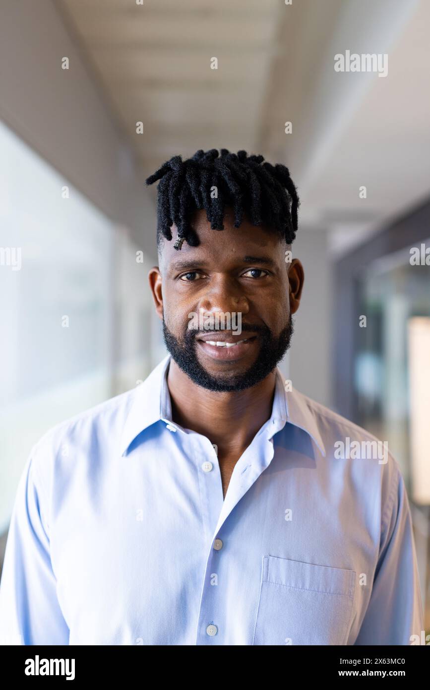 A middle-aged African American man, smiling at camera at office Stock Photo