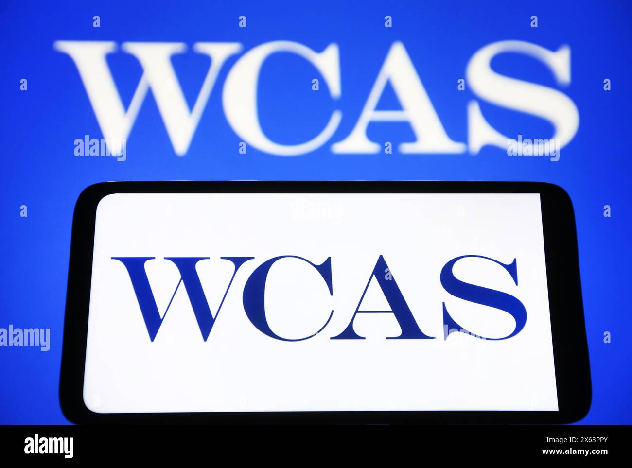 In this photo illustration, Welsh, Carson, Anderson & Stowe (WCAS) logo