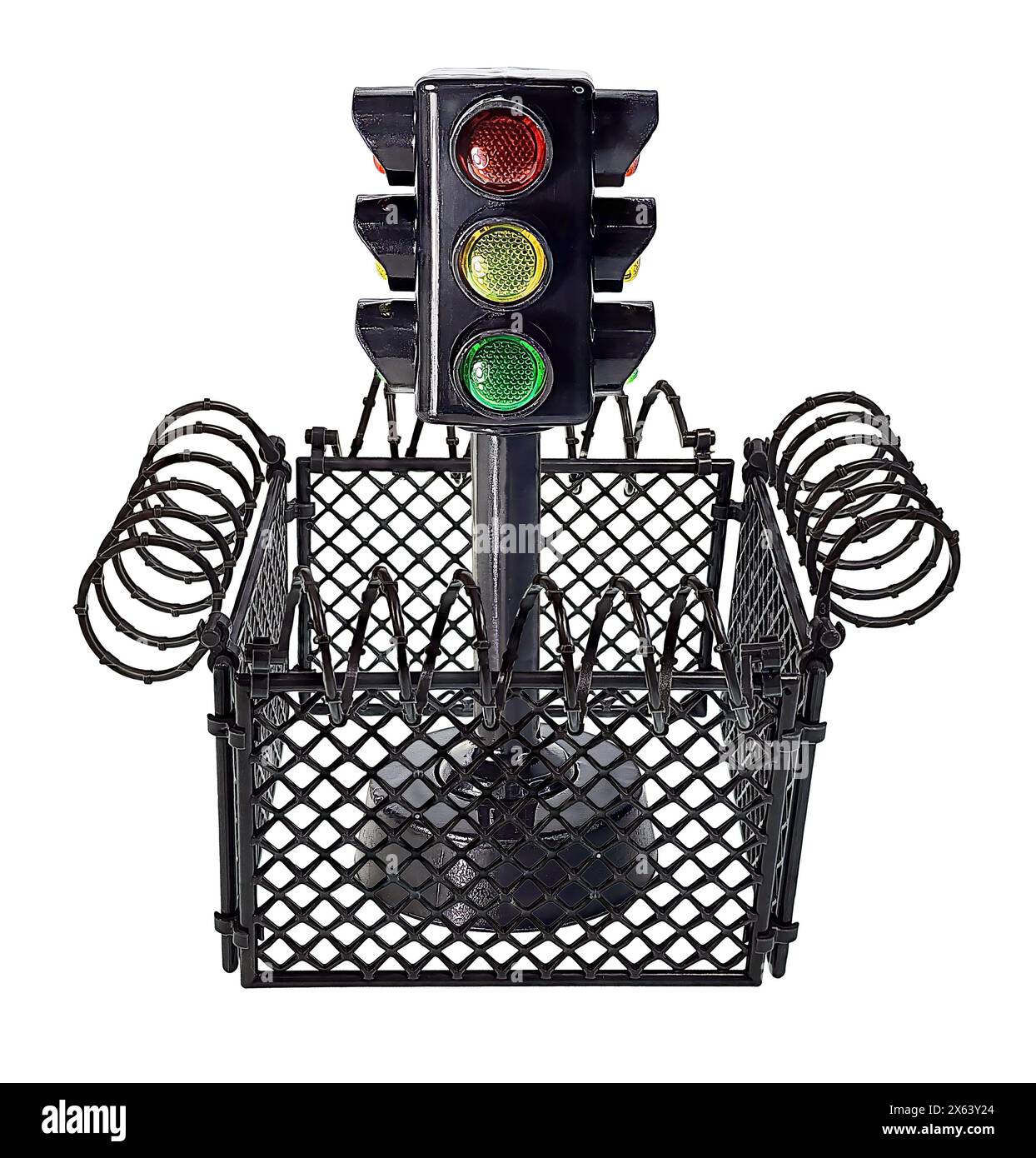 Prison yard surrounded by barbed wire with a traffic light to show that