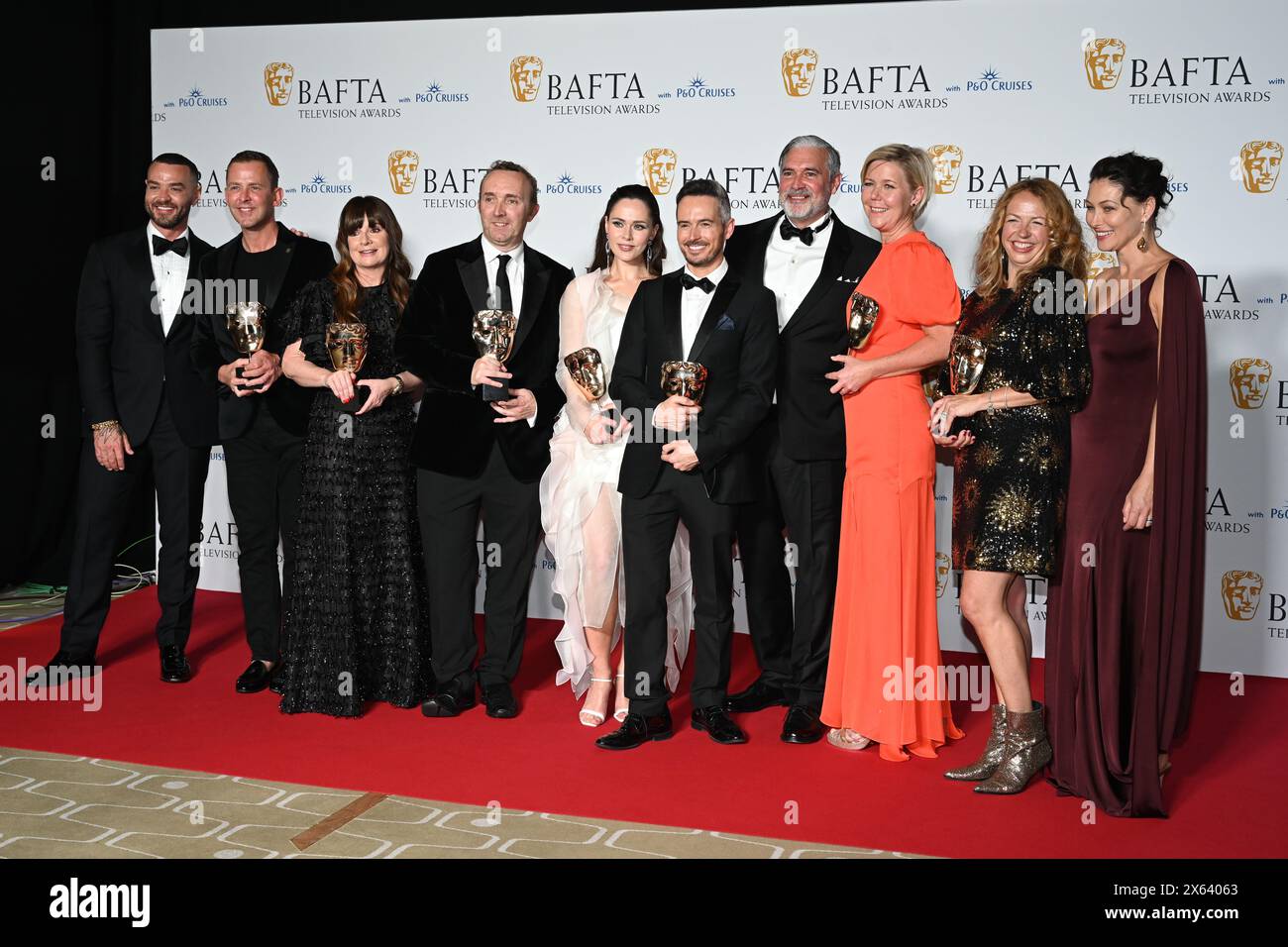 Royal Festival Hall, LONDON, ENGLAND, UK - MAY 12 2024: Matt Willis, Scott Mills, Suzy Lamb, Julia Sanina, Lee Smithurst, Nikki Parsons, Emma Willis and the production crew pose with the Live Event Coverage Award for 'Eurovision Song Contest 2023' in the Winners Room during the 2024 BAFTA Television Awards with P&O Cruises, London, UK. Credit: See Li/Picture Capital/Alamy Live News Stock Photo