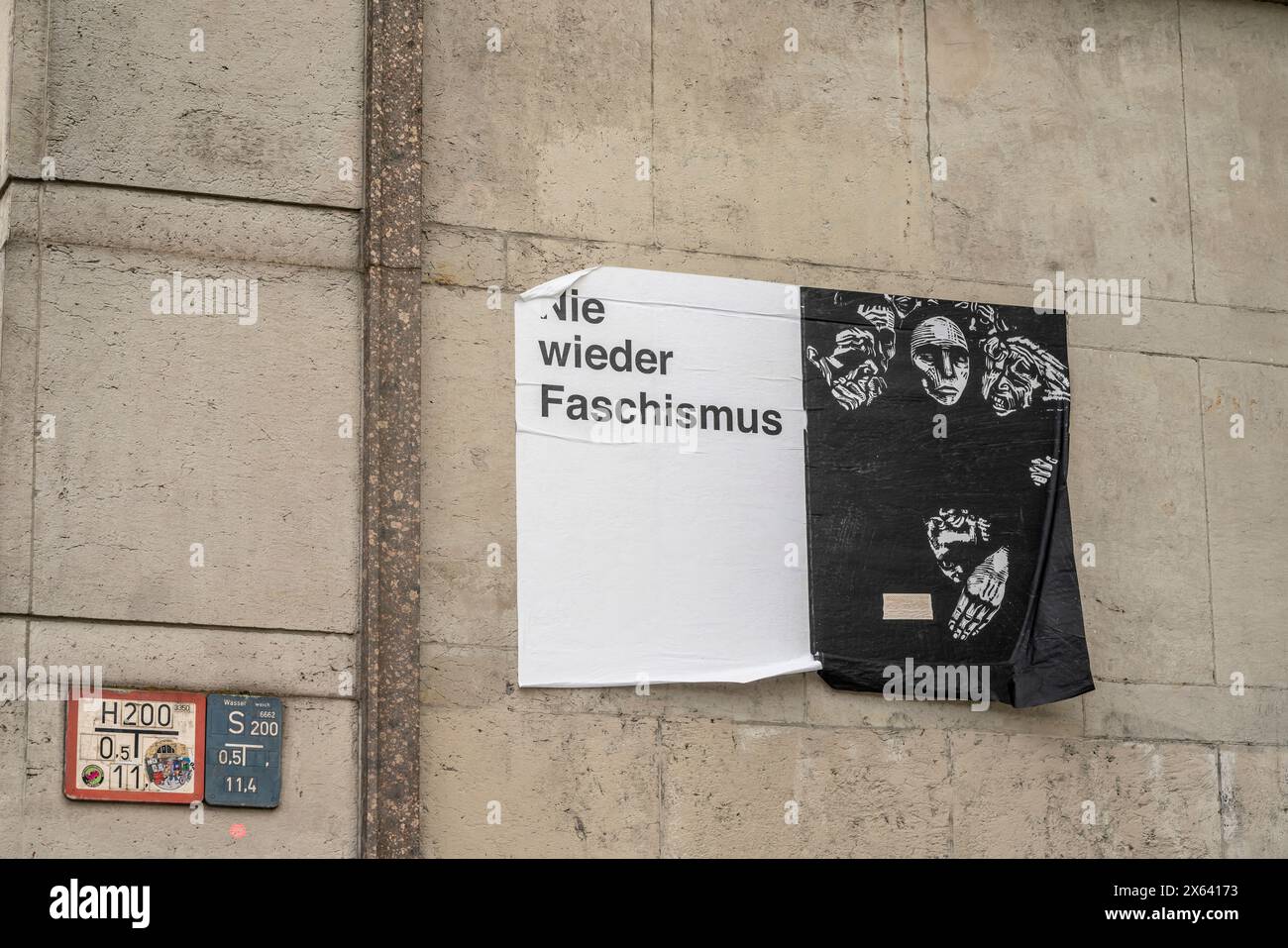 'Never again fascism' (Nie wieder Faschismus) thought provoking poster display at Frankfurter Tor in Friedrichshain, Berlin, Germany, Europe Stock Photo