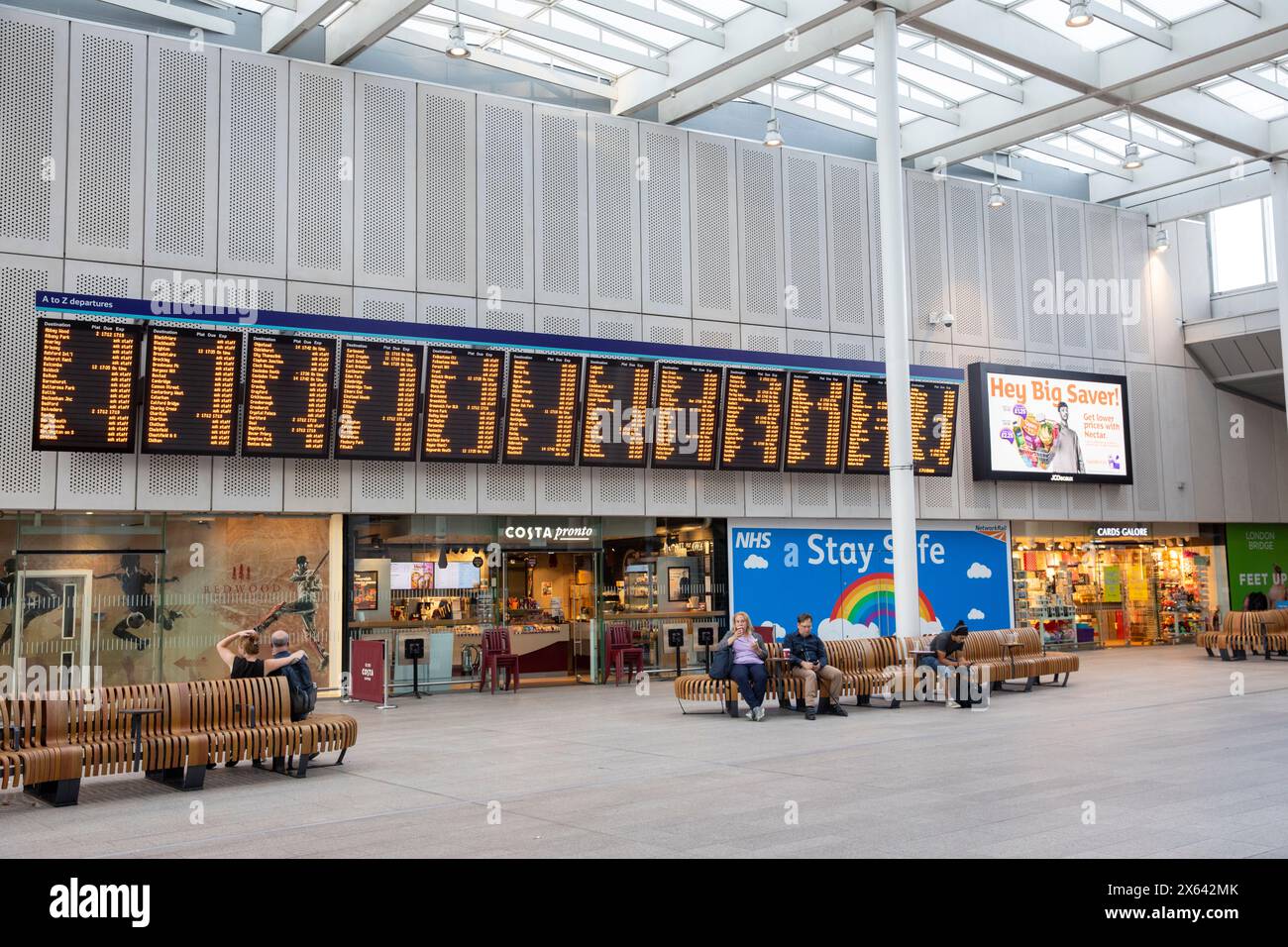 London Bridge railway station concourse and departure arrivals customer ...