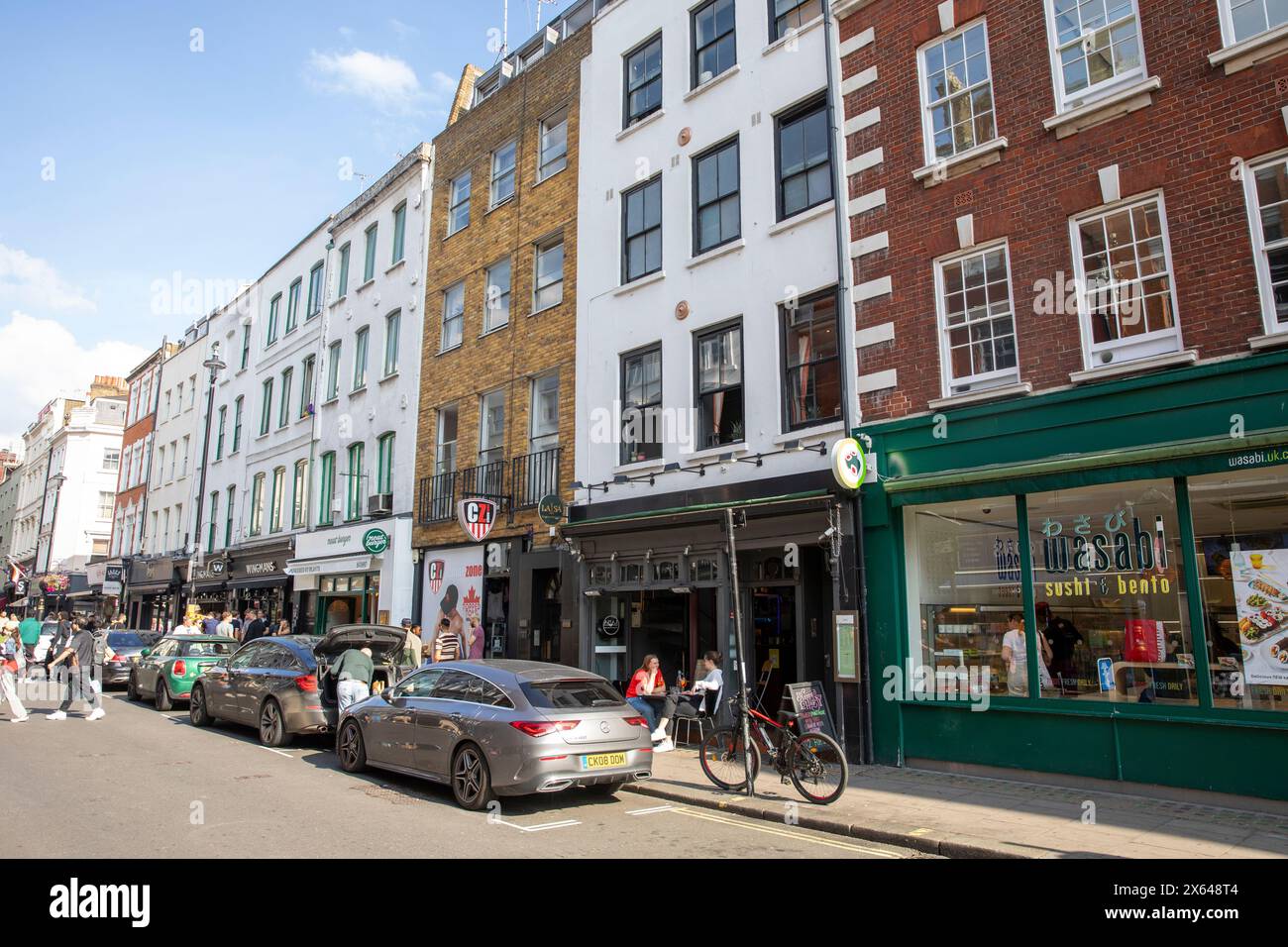 Old Compton street in Soho London, street scene London,Old Compton street has many gay bars and clubs shops,Central London,England,UK,2023 Stock Photo