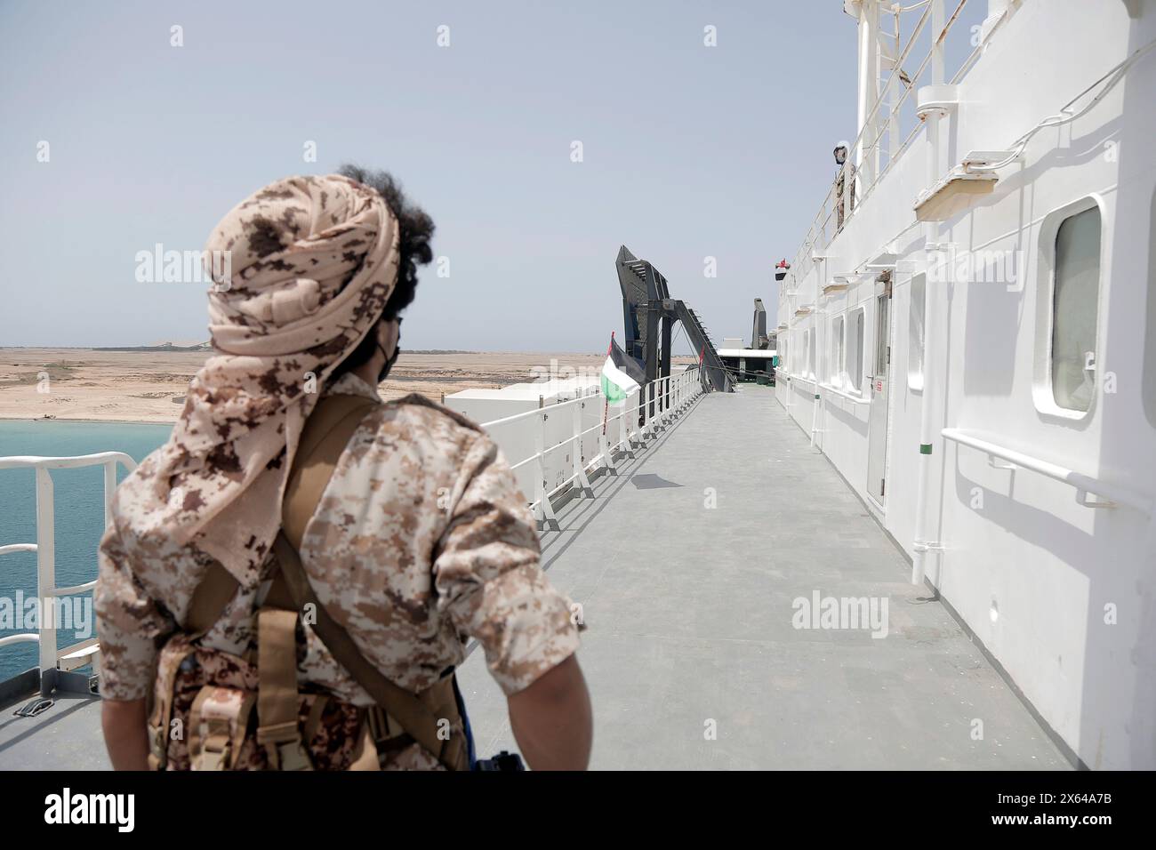 Hodeidah. 12th May, 2024. A Houthi group member stands on the deck of the Galaxy Leader near the port city of Hodeidah in western Yemen, May 12, 2024. A delegation from the International Committee of the Red Cross (ICRC) visited on Sunday the Galaxy Leader, a vehicle carrier hijacked by the Houthi group, and met with its crew near the port city of Hodeidah in western Yemen.TO GO WITH 'Int'l Red Cross delegation visits crew of hijacked ship in Yemen' Credit: Mohammed Mohammed/Xinhua/Alamy Live News Stock Photo