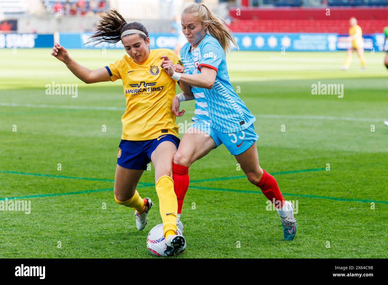 Bridgeview, Illinois, USA. 12th May, 2024. Chicago Red Stars forward Penelope Hocking (55) and Utah Royals FC defender Lauren Flynn (5) battle for the ball during NWSL Soccer match action between the Utah Royals FC and Chicago Red Stars at SeatGeek Stadium in Bridgeview, Illinois. John Mersits/CSM/Alamy Live News Stock Photo