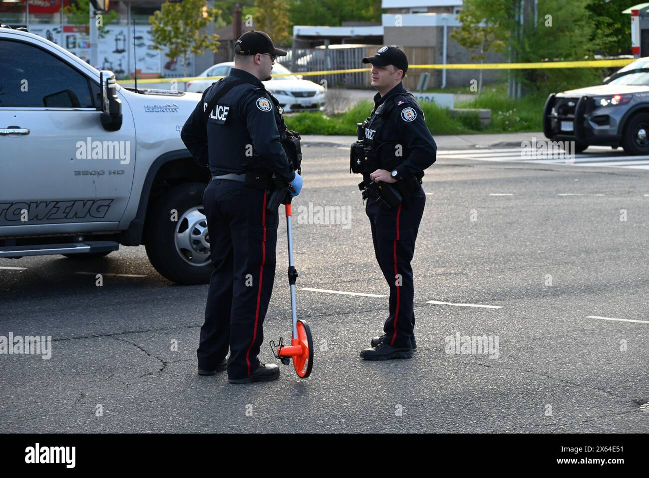 Police block off roads with crime scene tape to investigate a shooting that left one person injured in Scarborough. At approximately 4:54 p.m., Sunday afternoon police responded to the area of Kennedy Rd and Munham Gate for a driver shooting from a vehicle to a tow truck. Toronto police say that they located a victim suffering from gunshot wounds, the victim was transported to the hospital with non-life-threatening injuries. Police are actively searching for a suspect. This is the third shooting in the District of Scarborough involving a tow truck in less than 24 hours. (Photo by Kyle Mazza / Stock Photo
