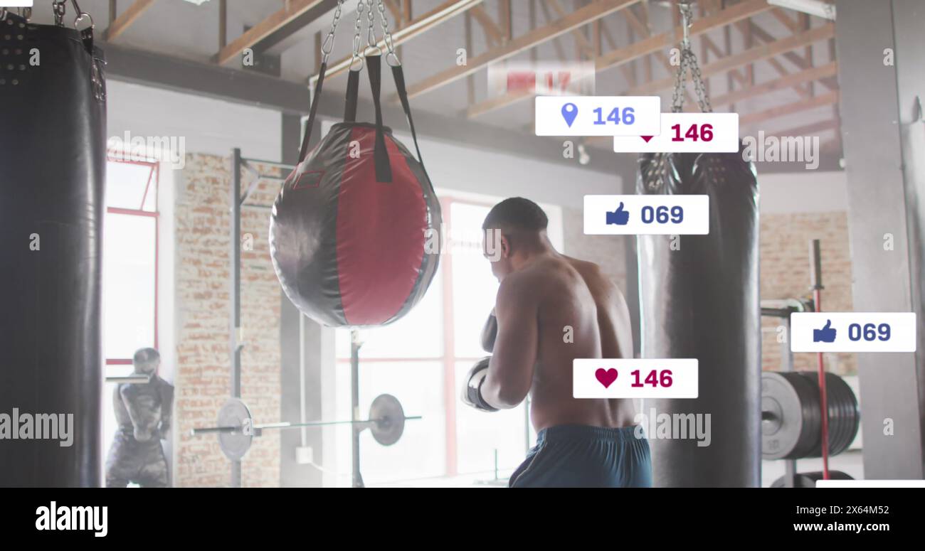 Image of multiple notification bars, african american boxer practicing punches on punching bag Stock Photo