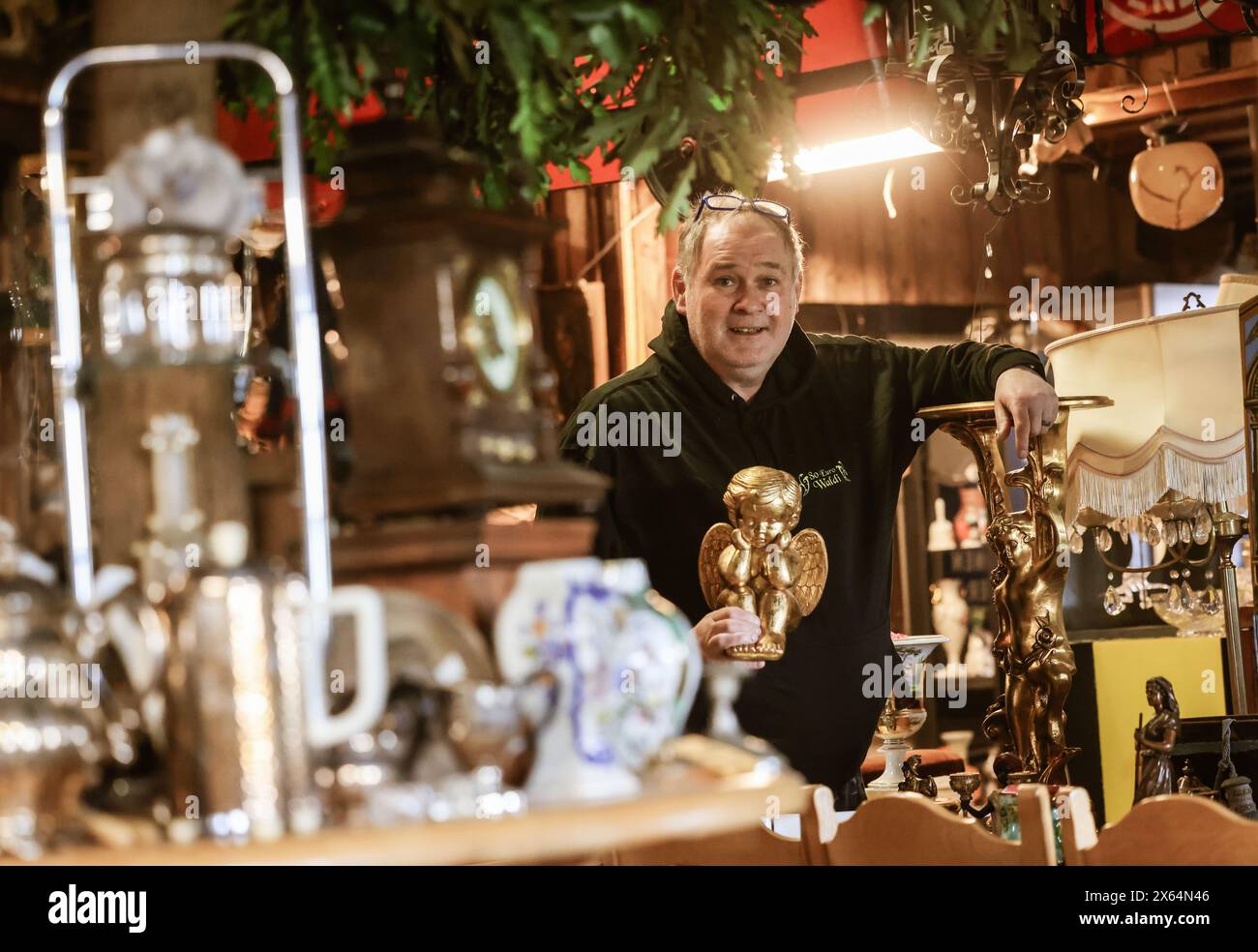 Kall, Germany. 26th Apr, 2024. Rummage dealer Waldi Lehnertz stands in his store. Lehnertz became famous because he always offers 80 euros on the ZDF show 'Bares für Rares', no matter what he is offered. Credit: Oliver Berg/dpa/Alamy Live News Stock Photo