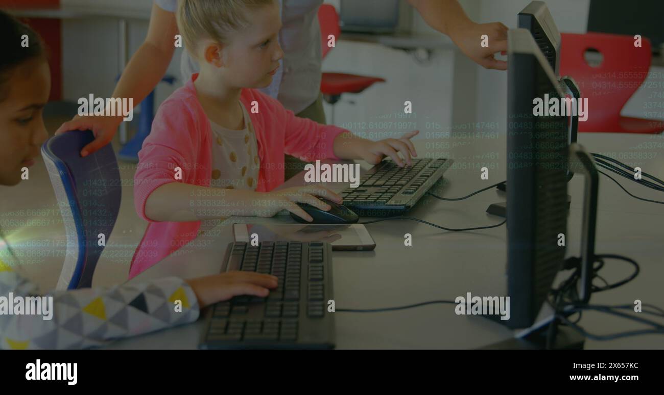School children using computers teacher hi-res stock photography and ...