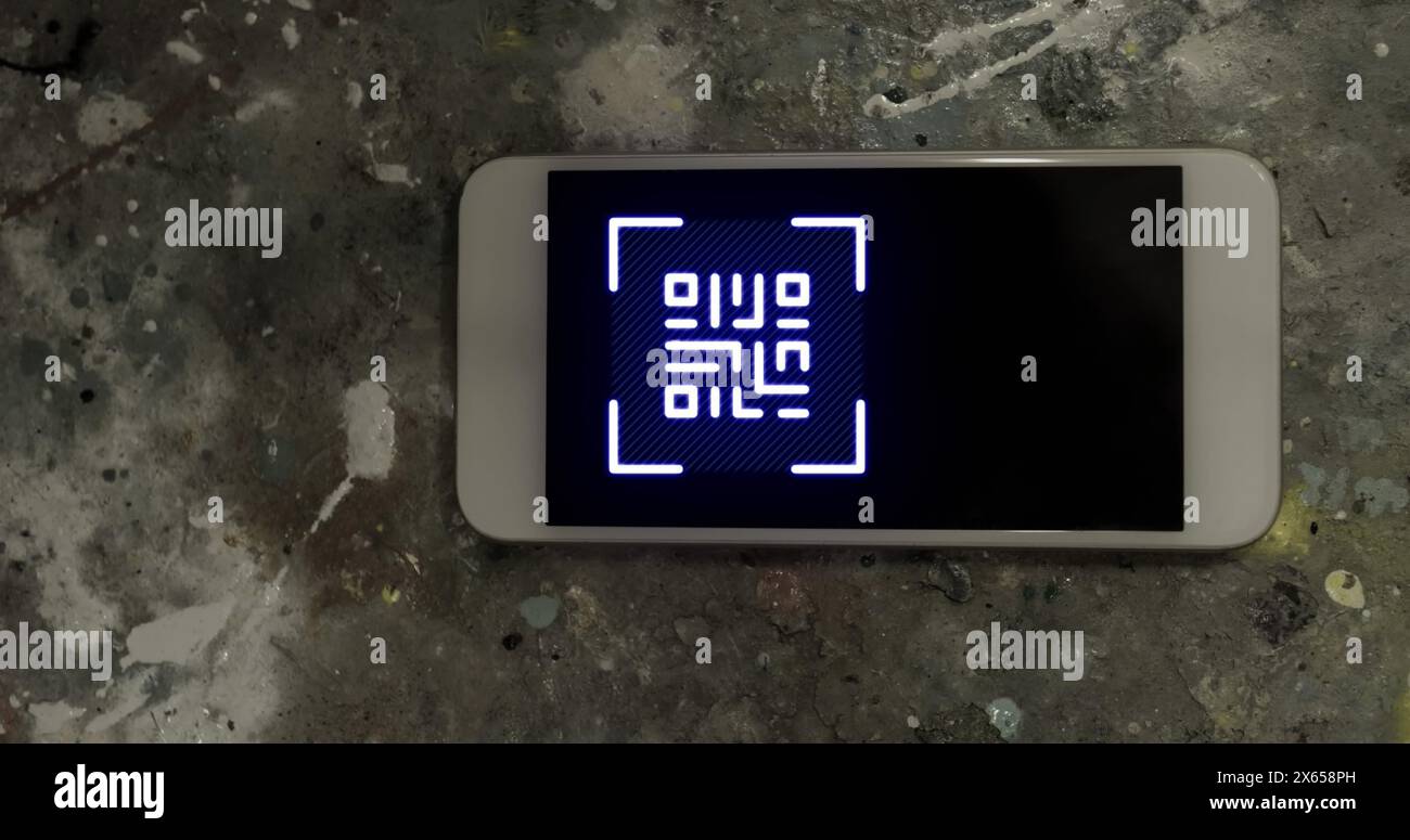 Image of gr code over smartphone lying on grey surface Stock Photo