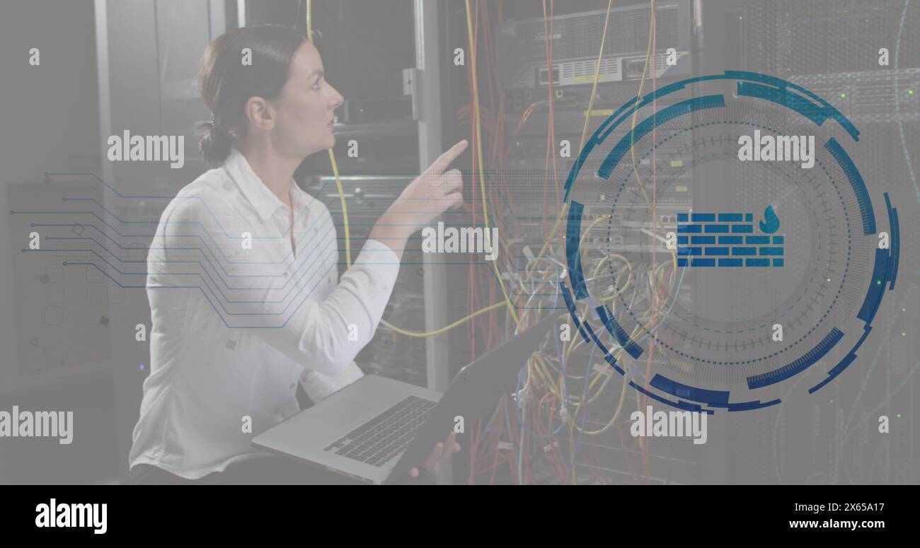 Image of firewall in loading circles, caucasian female engineer checking server using laptop Stock Photo