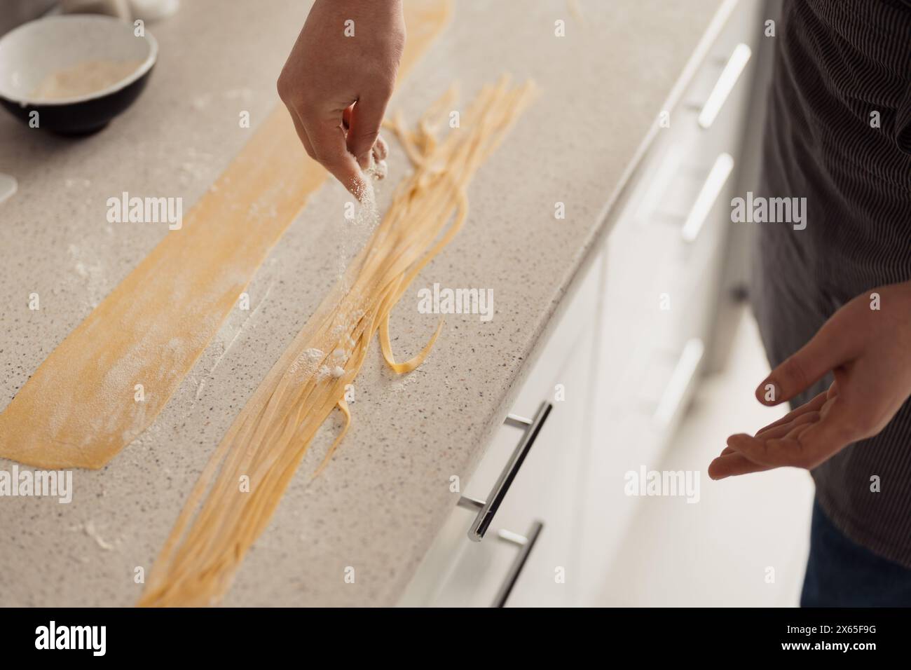 Making fresh homemade pasta dough in modern kitchen Stock Photo - Alamy