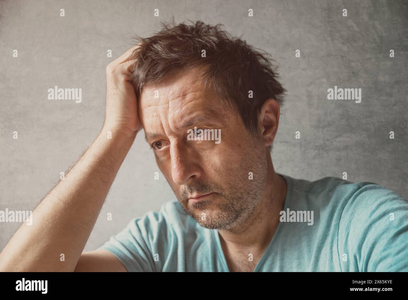 Portrait of solemn pensive mature adult caucasian man, selective focus Stock Photo