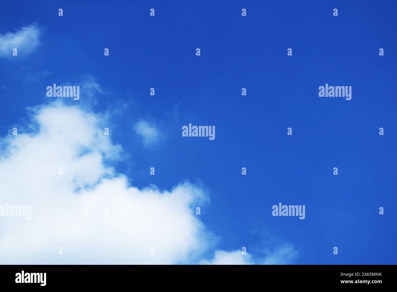 Fluffy White Cumulus Clouds on Vivid Blue Sunny Sky Stock Photo - Alamy