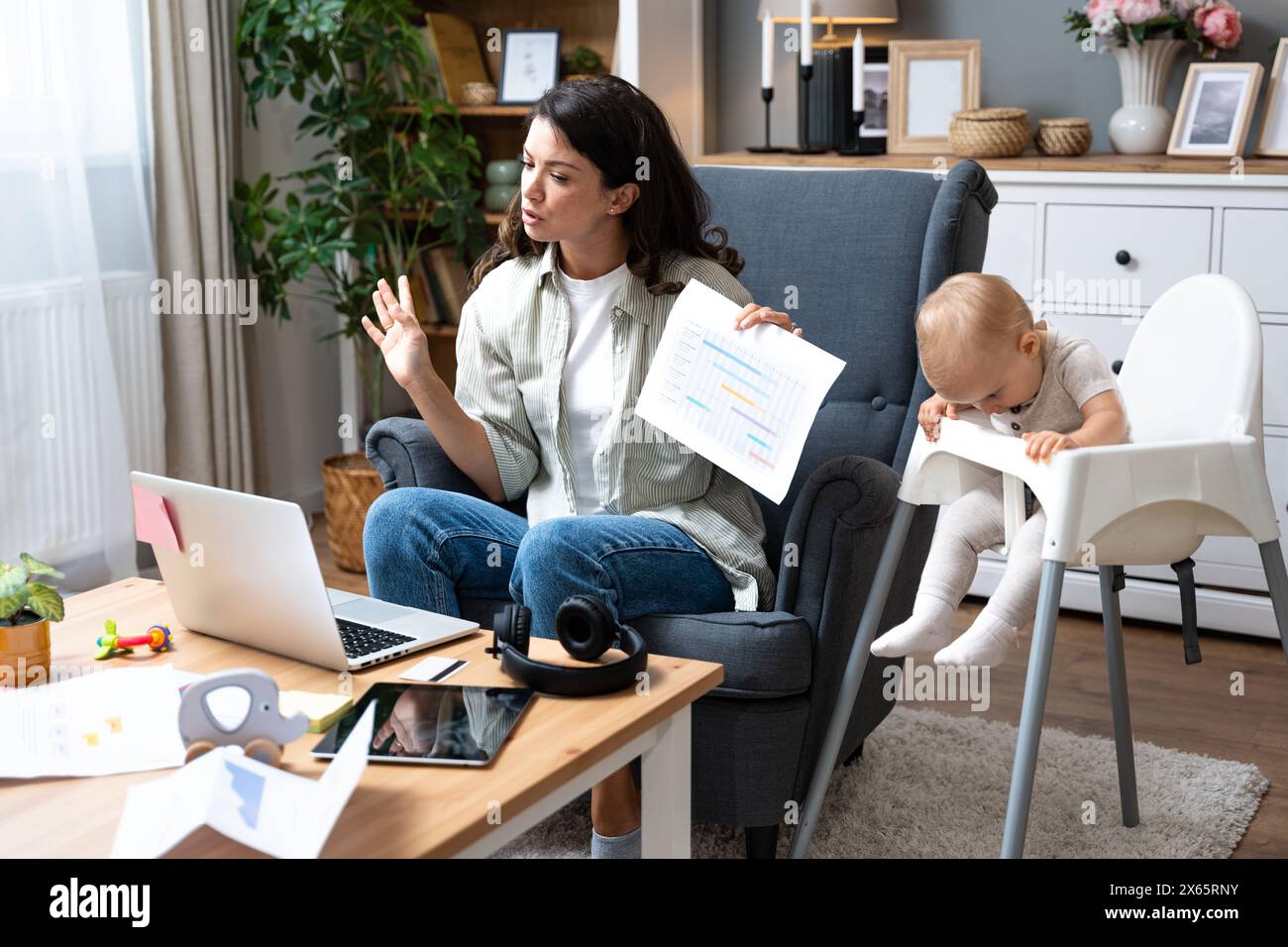 Multitasking mother. Young freelance business mom taking care of her ...