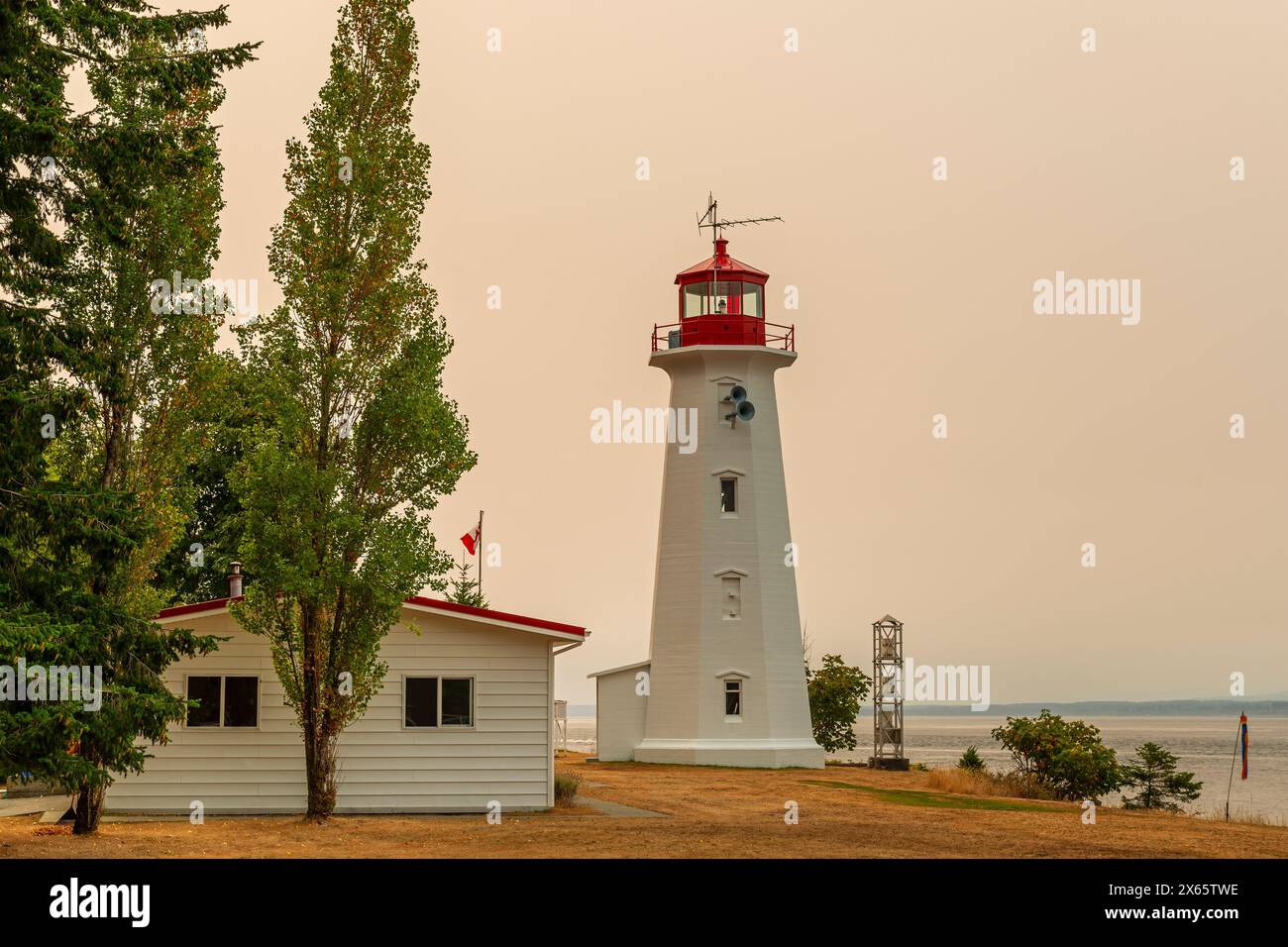 Cape Mudge Lighthouse With Red Glow Of Forest Wildfires, Quadra Island ...