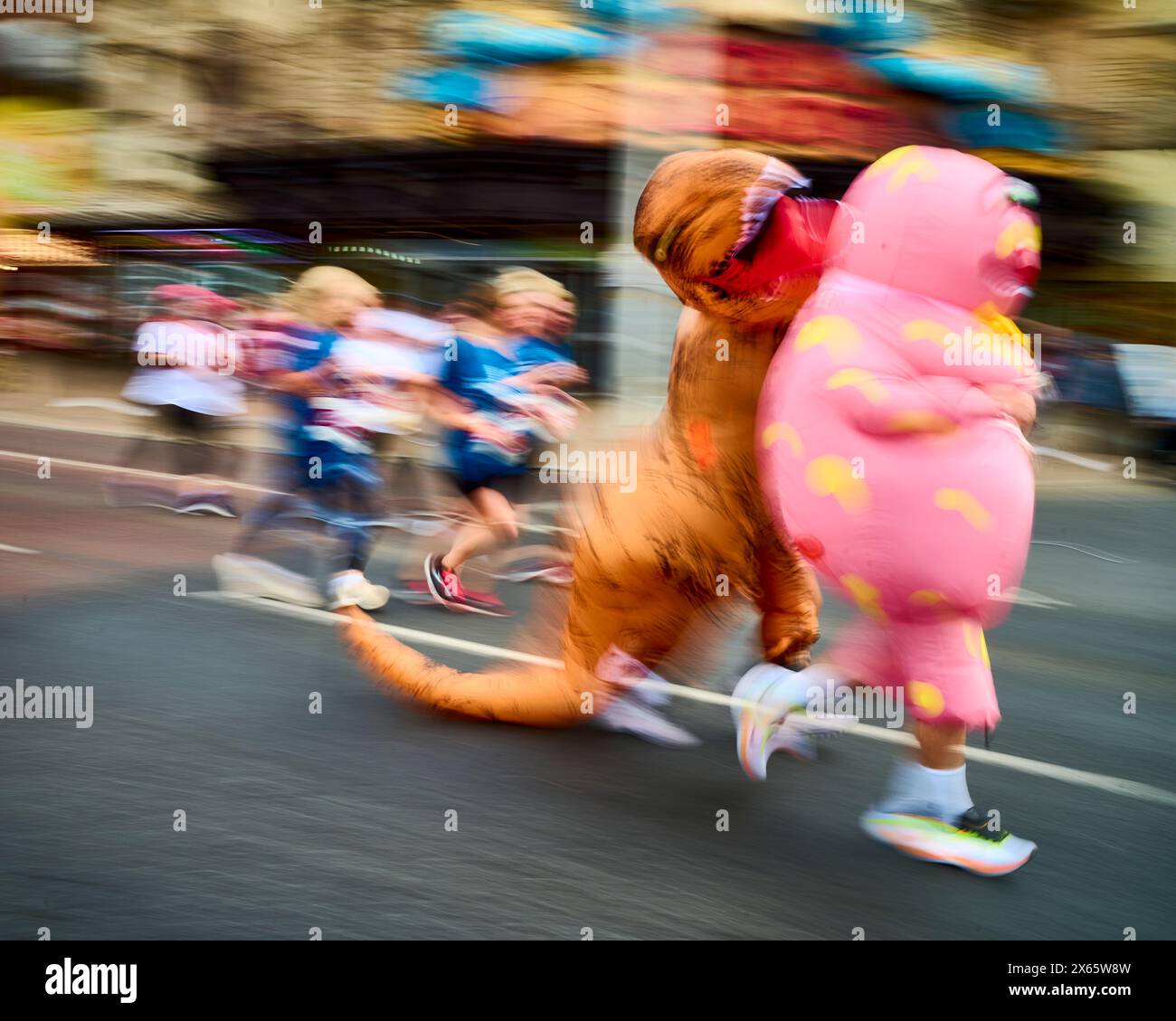 Motion blur of dinosaur and Mr Blobby in the Blackpool 10 K fun run ...