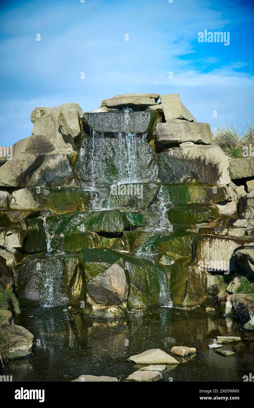 Artificial waterfall and small pool Stock Photo