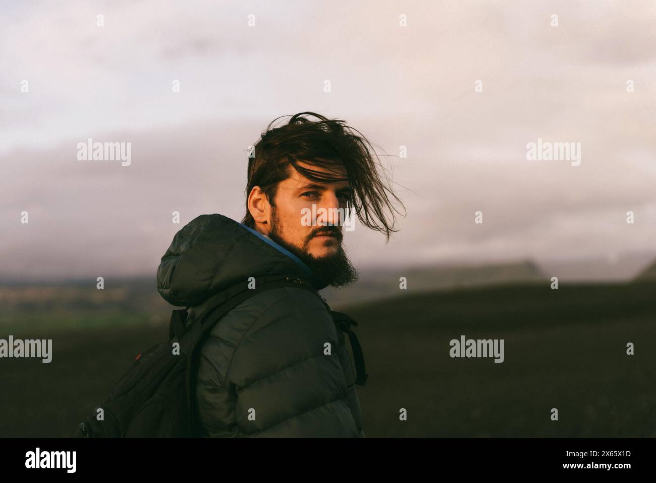 Man traveler with a backpack in Iceland. Stock Photo