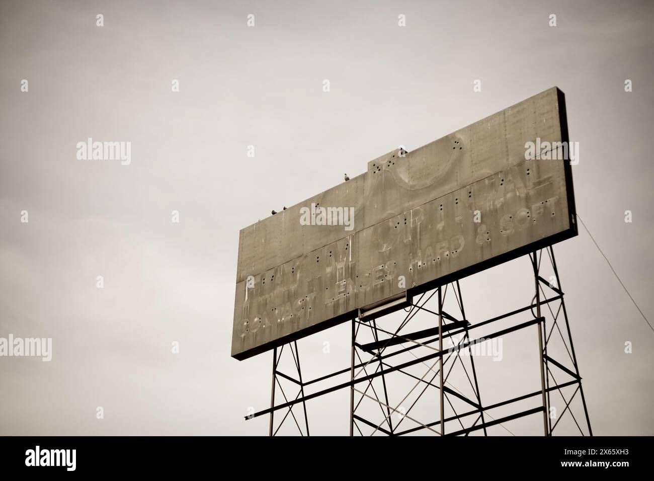 Abandoned billboard former neon sign trace of glasses Stock Photo