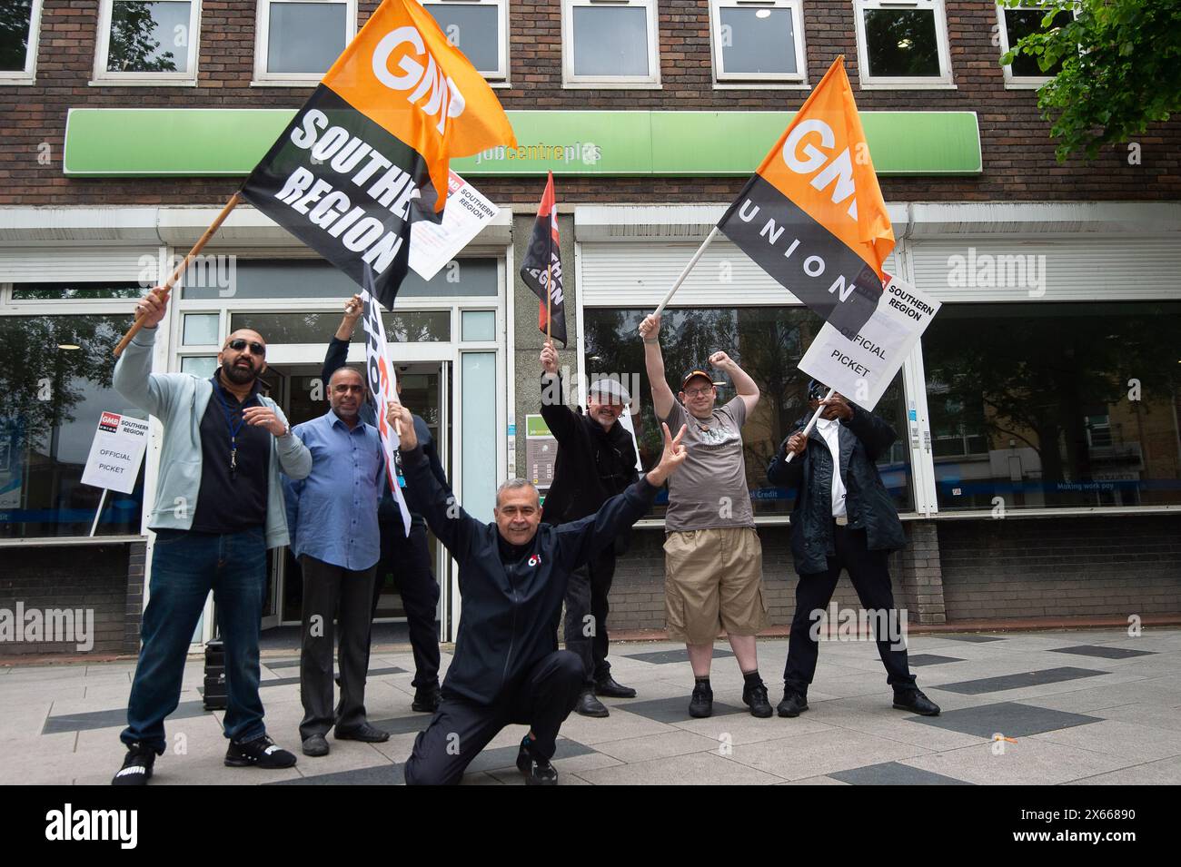 Slough, UK. 13th May, 2024. Security guards were on strike today outside the Job Centre Plus in Slough, Berkshire. They are holding a 24 hour strike in a dispute over their pay rates. GMB said more than 1,000 of its members employed by G4S will walk out today with further strike action planned for later this month. A survey of GMB members found four out of five had experienced abuse in their jobs, including being attacked by dogs and punched by members of the public. Many described daily verbal abuse, including threats to their families, racist abuse and death threats. GMB national officer Eam Stock Photo