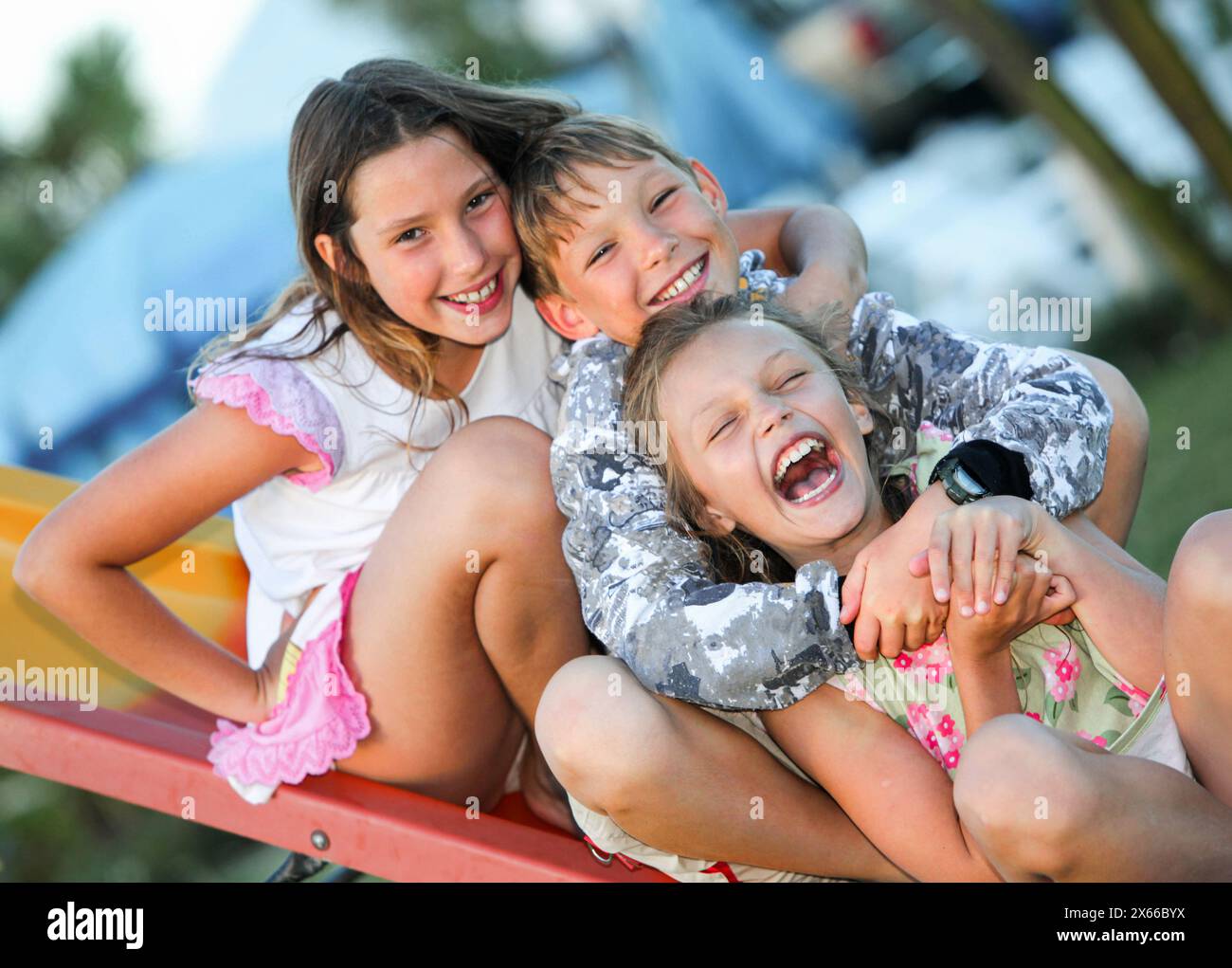 Group laughing at girl children hi-res stock photography and images - Alamy