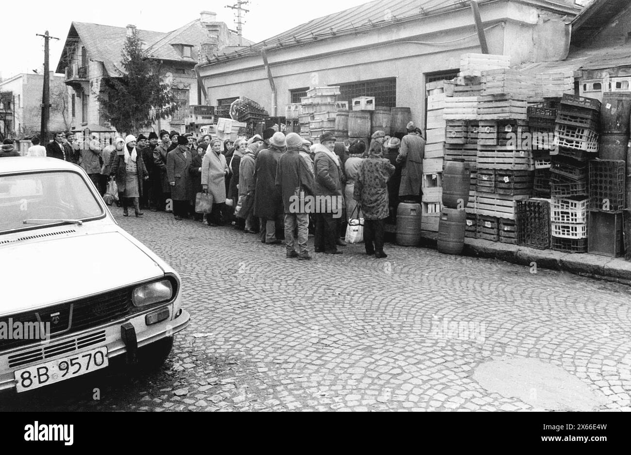 Bucharest, Romania, January 1990. Right after the collapse of the communist regime, people were still waiting in long lines to get a hold of basic groceries. Stock Photo