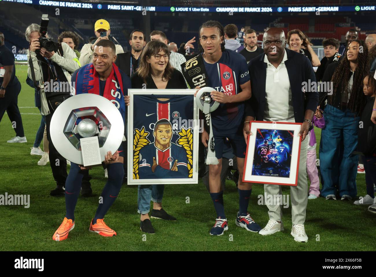 Paris, France. 13th May, 2024. Kylian Mbappe of PSG, Fayza Lamari, Ethan Mbappe of PSG, Wilfried Mbappe celebrate winning the Ligue 1 championships during the trophy ceremony following the French championship Ligue 1 football match between Paris Saint-Germain and Toulouse FC on May 12, 2024 at Parc des Princes stadium in Paris, France - Photo Jean Catuffe/DPPI Credit: DPPI Media/Alamy Live News Stock Photo