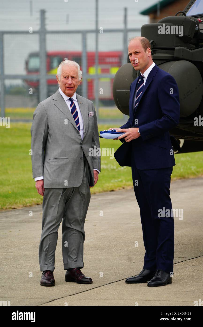 King Charles III and the Prince of Wales during a visit to the Army Aviation Centre at Middle Wallop, Hampshire, for the King to officially hand over the role of Colonel-in-Chief of the Army Air Corps to William. Picture date: Monday May 13, 2024. Stock Photo