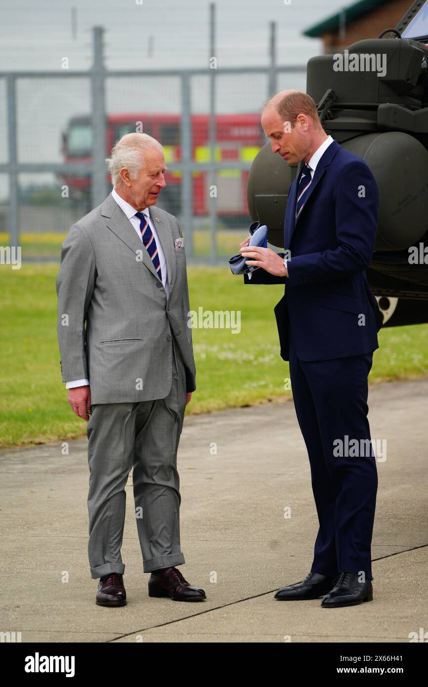 King Charles III and the Prince of Wales during a visit to the Army Aviation Centre at Middle Wallop, Hampshire, for the King to officially hand over the role of Colonel-in-Chief of the Army Air Corps to William. Picture date: Monday May 13, 2024. Stock Photo