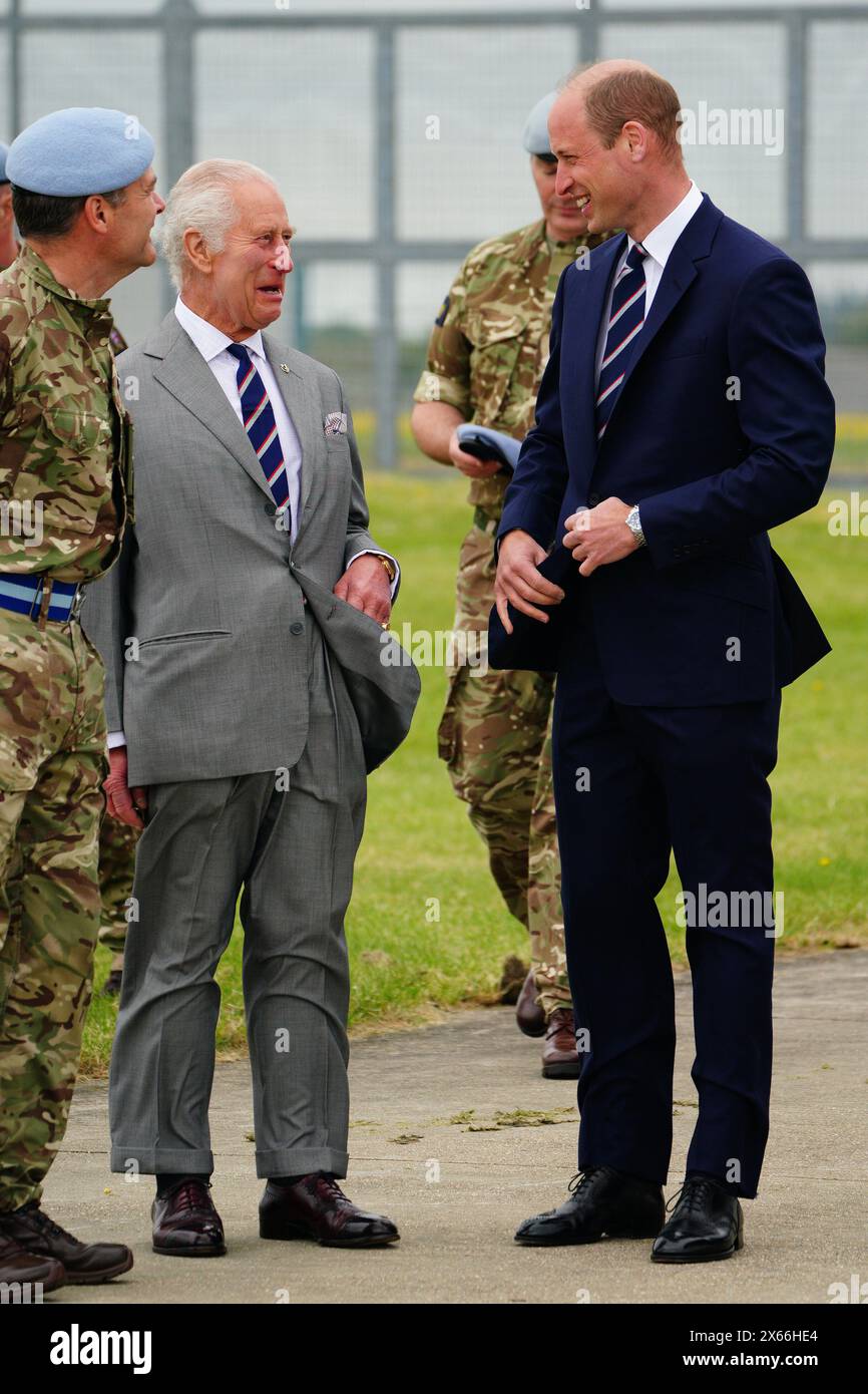 King Charles III and the Prince of Wales meet members of the military during a visit to the Army Aviation Centre at Middle Wallop, Hampshire, for the King to officially hand over the role of Colonel-in-Chief of the Army Air Corps to William. Picture date: Monday May 13, 2024. Stock Photo