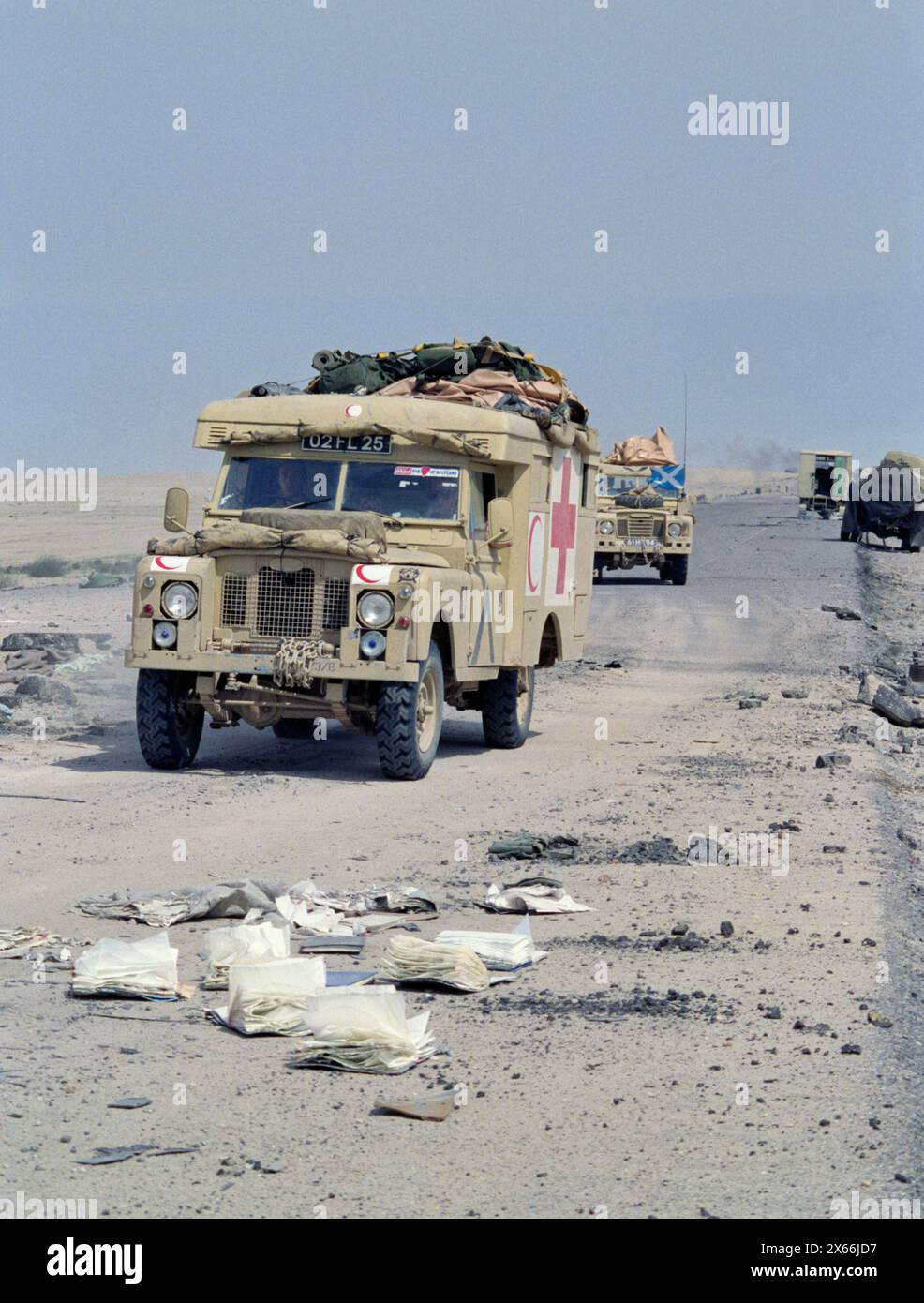5th March 1991 Two British Army Land Rovers of the King's Own Scottish Borderers pass Iraqi military vehicles abandoned and wrecked, recently attacked by USAF fighter jets on Route 801, the road to Um Qasr, north of Kuwait City. Stock Photo