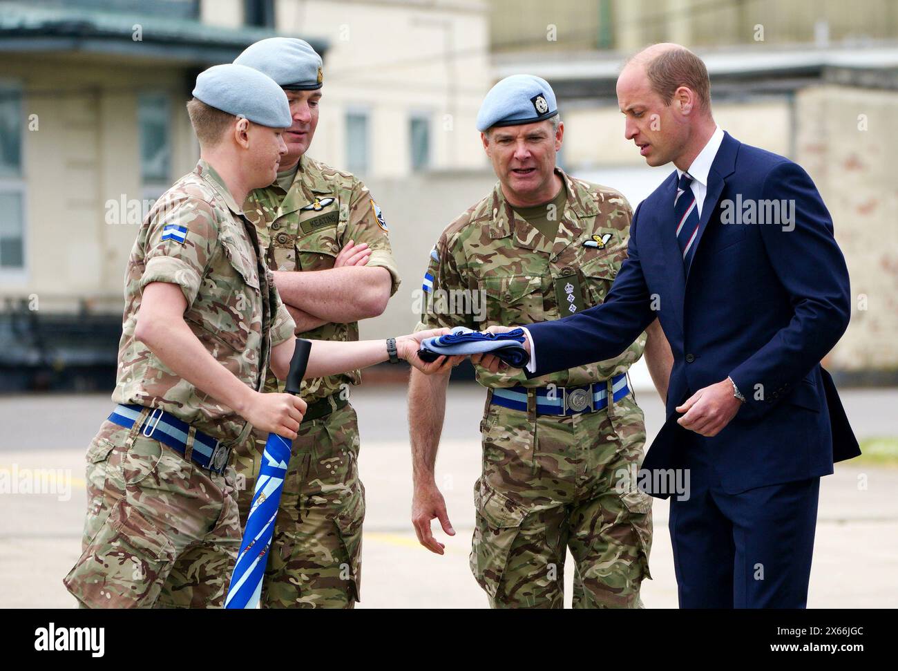 The Prince of Wales with members of the military during a visit to the Army Aviation Centre at Middle Wallop, Hampshire, for King Charles IIIto officially hand over the role of Colonel-in-Chief of the Army Air Corps to Prince William. Picture date: Monday May 13, 2024. Stock Photo