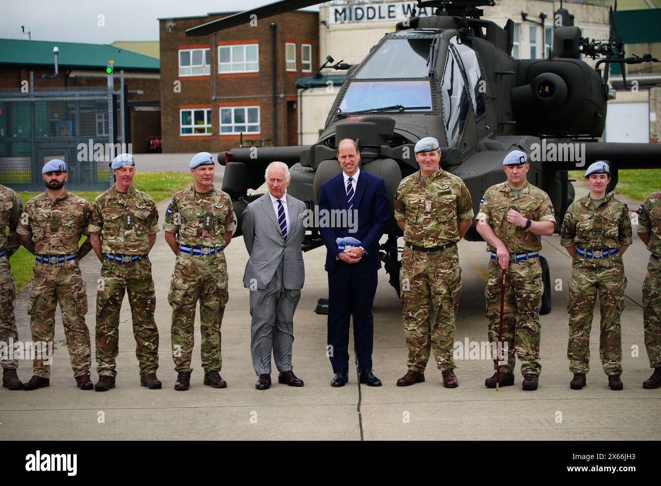 King Charles III and the Prince of Wales pose for a photograph with members of the military during a visit to the Army Aviation Centre at Middle Wallop, Hampshire, for the King to officially hand over the role of Colonel-in-Chief of the Army Air Corps to the Prince of Wales. Picture date: Monday May 13, 2024. Stock Photo