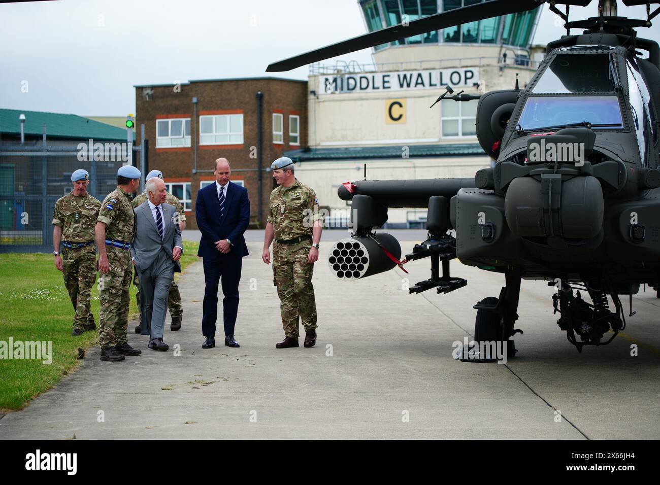 King Charles III and the Prince of Wales walk with members of the military during a visit to the Army Aviation Centre at Middle Wallop, Hampshire, for the King to officially hand over the role of Colonel-in-Chief of the Army Air Corps to the Prince of Wales. Picture date: Monday May 13, 2024. Stock Photo