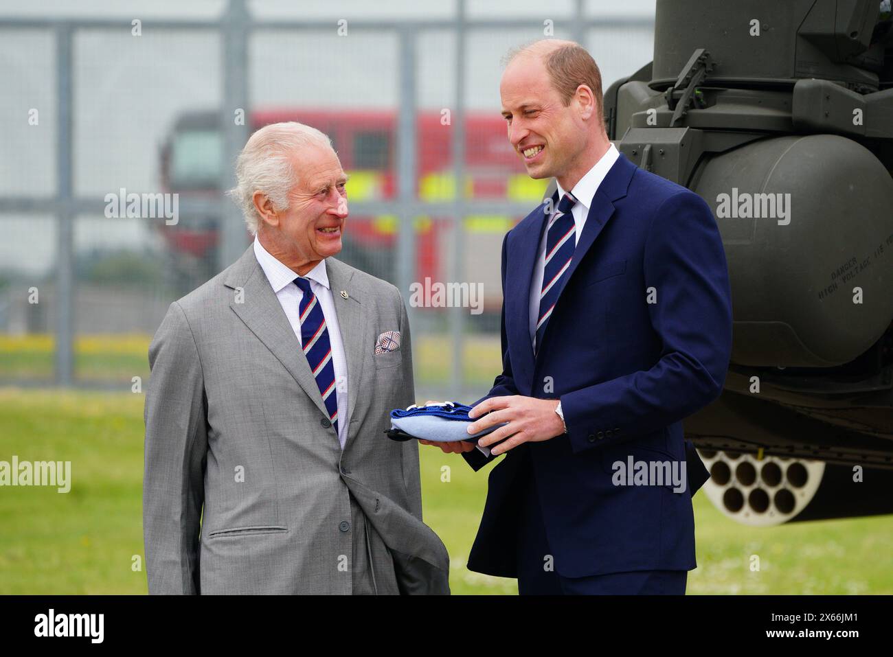King Charles III and the Prince of Wales during a visit to the Army Aviation Centre at Middle Wallop, Hampshire, for the King to officially hand over the role of Colonel-in-Chief of the Army Air Corps to the Prince of Wales. Picture date: Monday May 13, 2024. Stock Photo