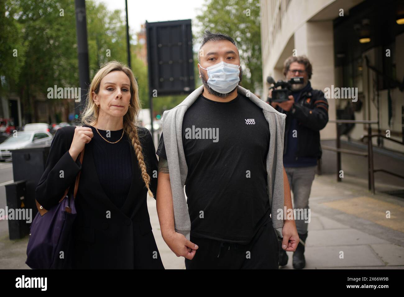 Chi Leung Wai (right) leaves Westminster Magistrates' Court, central London, where he was freed on bail after appearing charged under the National Security Act of assisting a foreign intelligence service in Hong Kong. Chi Leung (Peter) Wai, 38, of Staines-upon-Thames, Matthew Trickett, 37, of Maidenhead, and Chung Biu Yuen, 63, of Hackney, have each been charged with assisting a foreign intelligence service, contrary to section 3(1) and (9) of the National Security Act 2023. They have also each been charged with foreign interference, contrary to section 13(2) and (7) of the National Security A Stock Photo