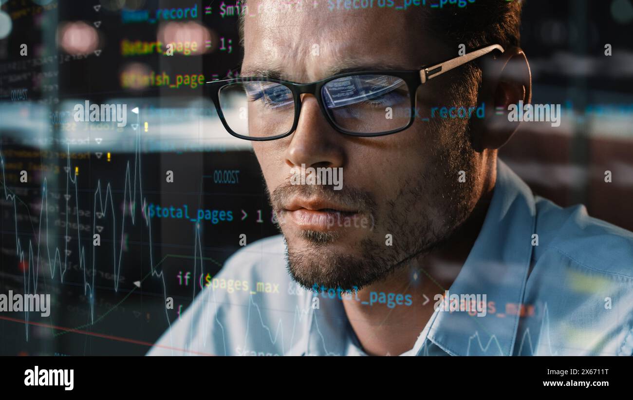Close-up Portrait of Software Engineer Working on Computer, Line of Code Run Aroung Him. Developer Working on Innovative e-Commerce Application using Big Data Concept Stock Photo
