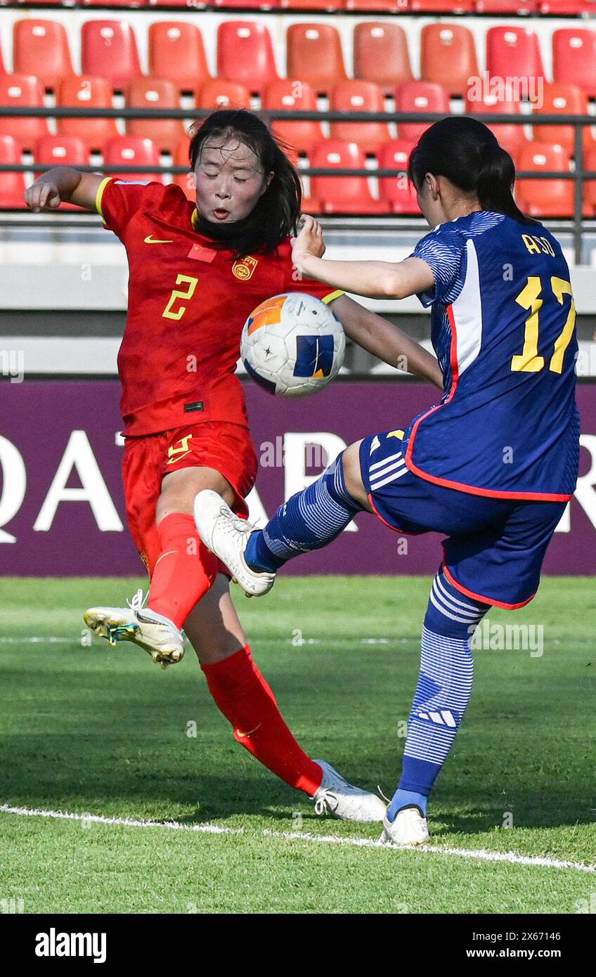 Bali, Indonesia. 13th May, 2024. Zhang Jie (L) of China vies with Aso