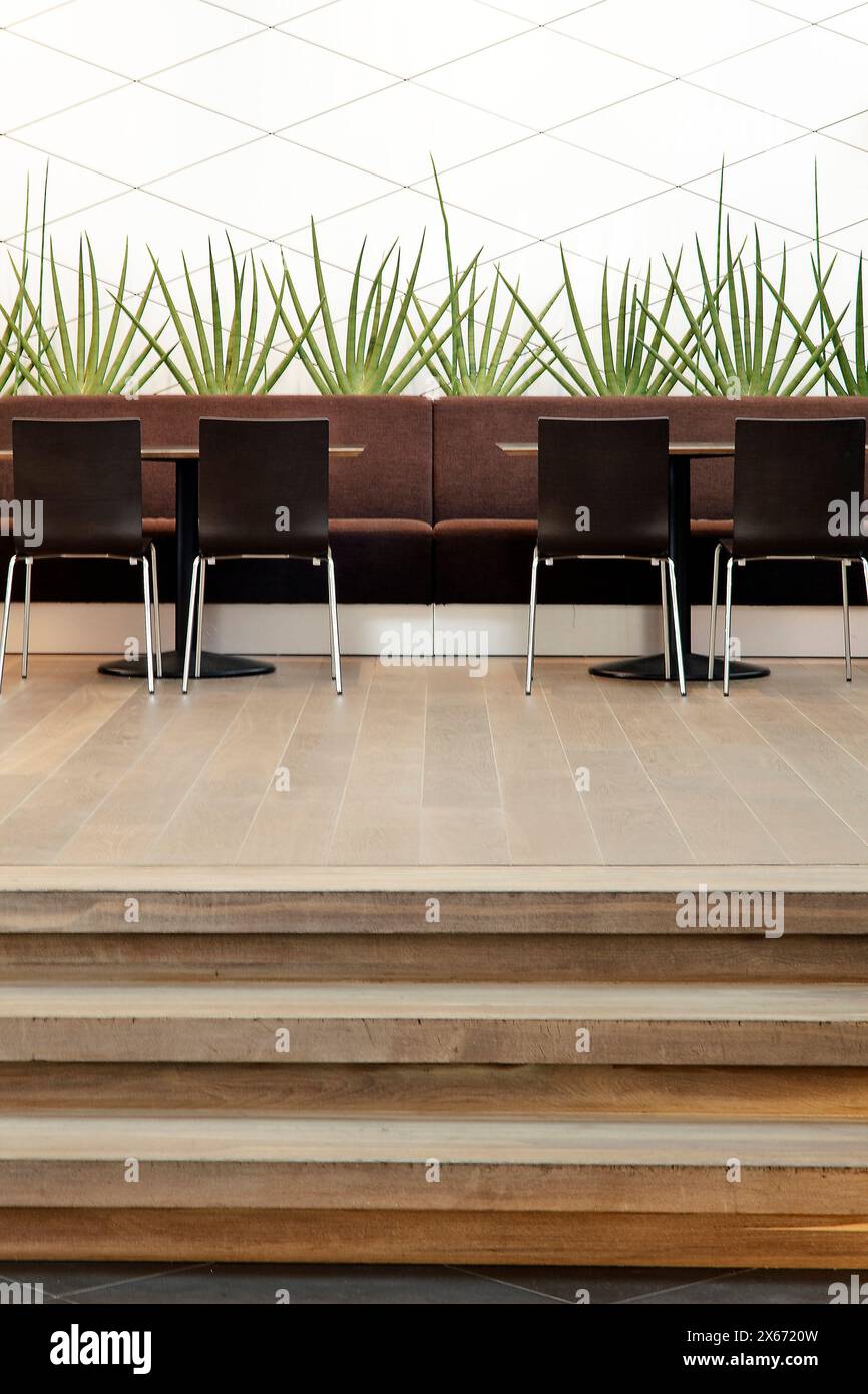 Detail of canteen seating and feature wall. SwedBank Vilnius, Lithuania, Vilnius, Lithuania. Architect: Audrius Ambrasas Architects, 2010. Stock Photo