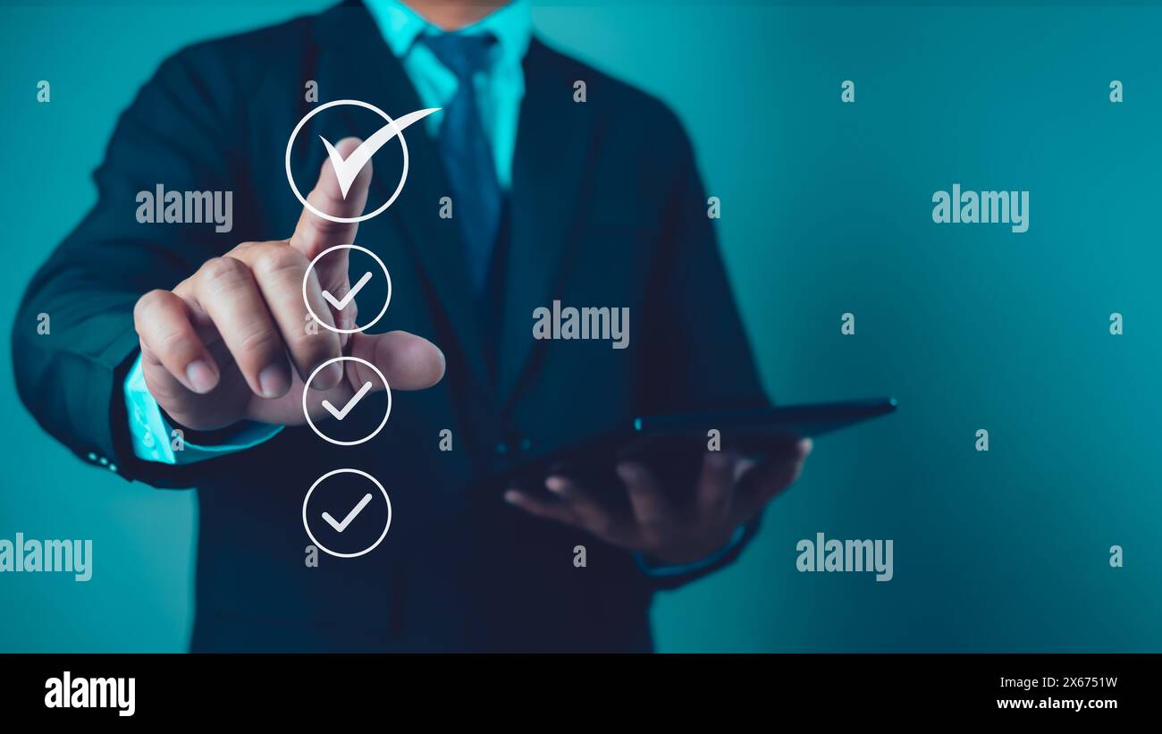 Businessman uses tablet to checklist and filling survey form online