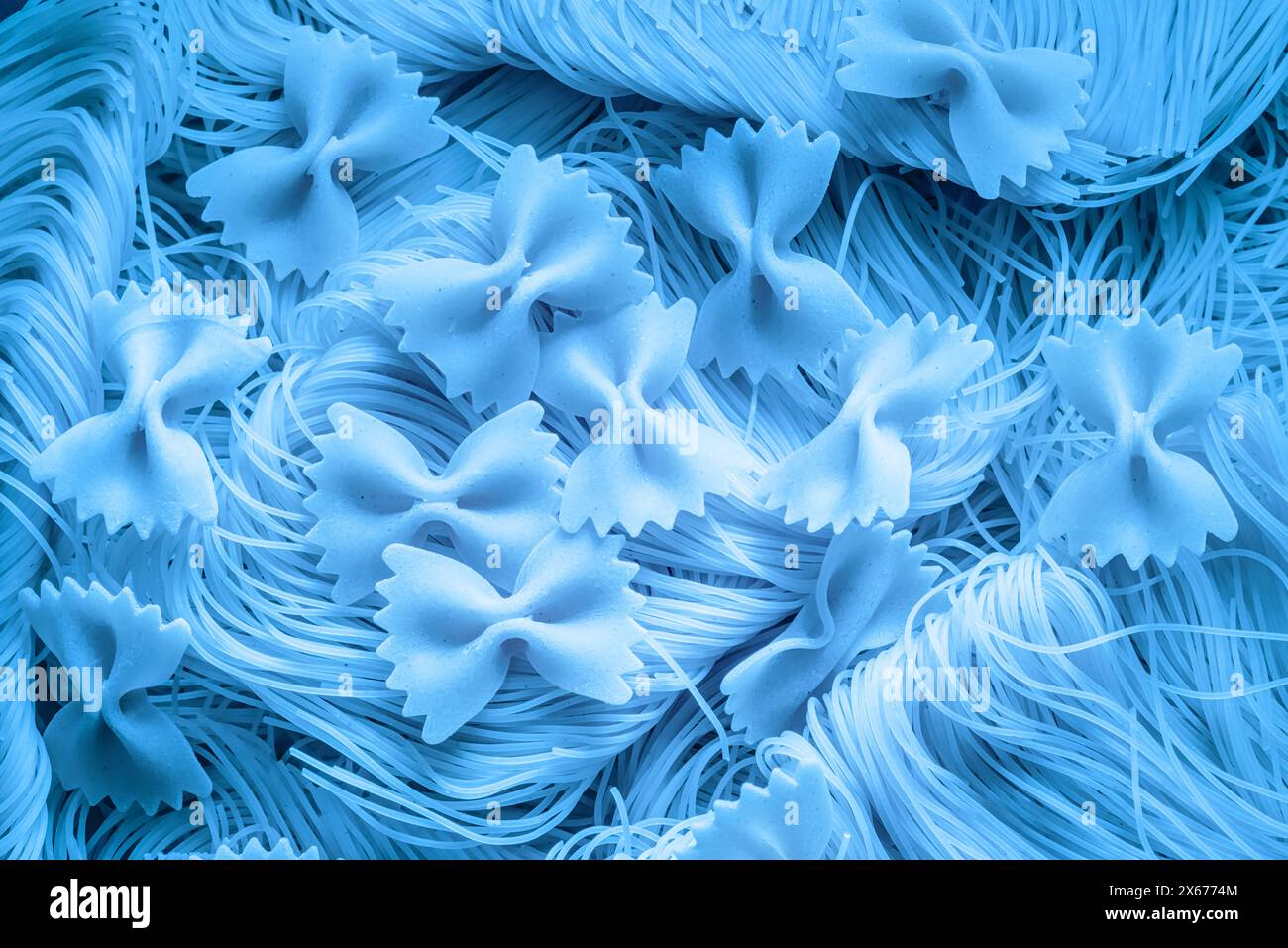 Blue colored food background made with italian pasta. Stock Photo