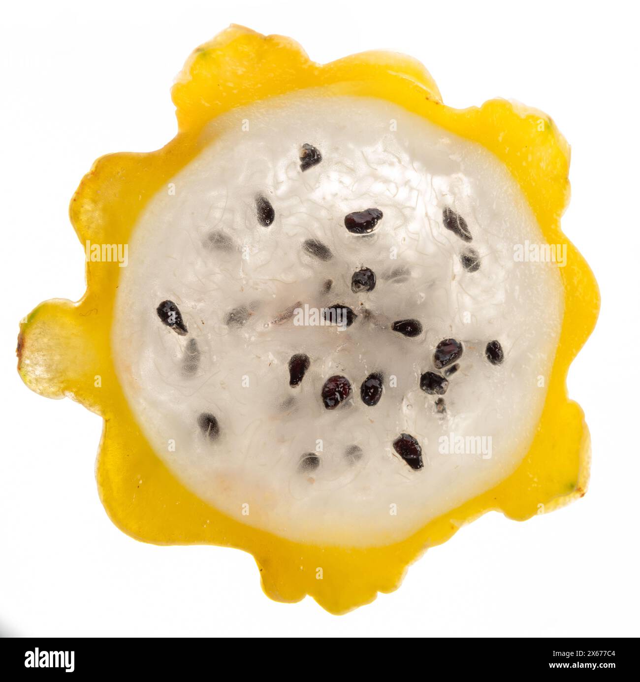 Yellow dragon fruit slice with white flesh and crunchy black seeds ...
