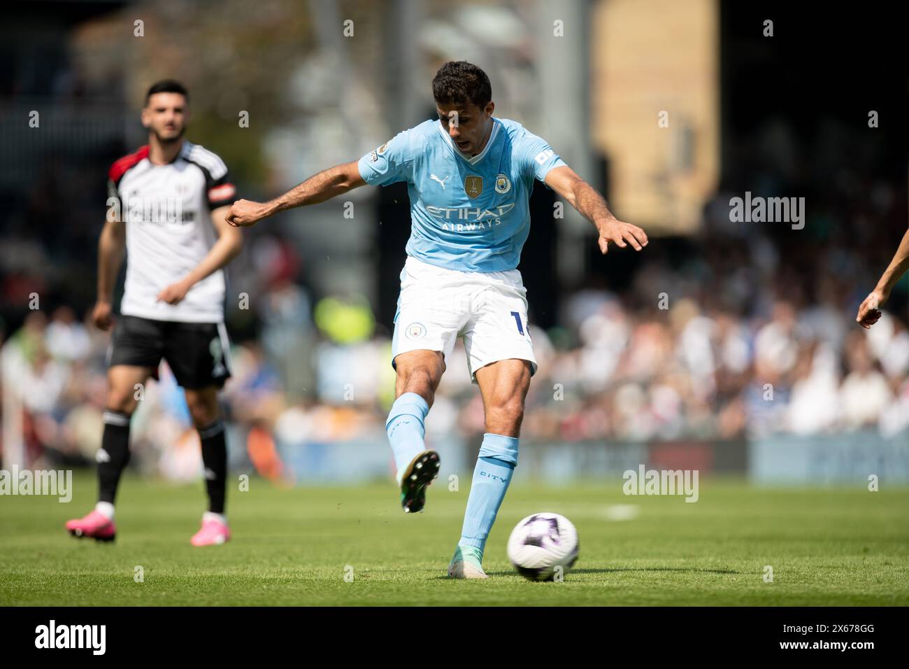 Rodri of Manchester City in action during the Premier League match between Fulham and Manchester City at Craven Cottage, London on Saturday 11th May 2024. (Photo: Federico Maranesi | MI News) Stock Photo