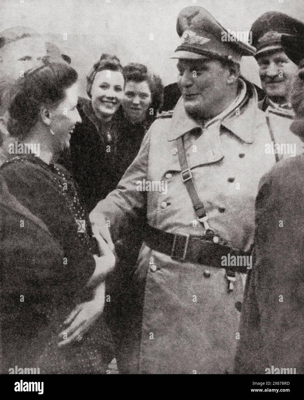 Hermann Wilhelm Göring, or Goering, 1893 –1946.  German politician, military leader, and convicted war criminal.  Seen here visiting bomb damaged areas in the Reich during WWII.  From The War in Pictures, Fifth Year. Stock Photo