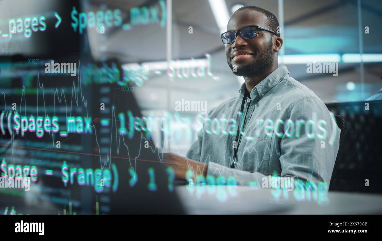 Real Office: Professional Black IT Programmer Working on Desktop Computer. Male Website Developer and Software Engineer Developing App, Video Game. Shot with Visual Effects of Running Code. Stock Photo