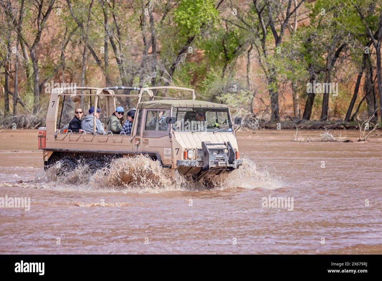 Pinzgauer off road vehicle splashing through meltwater river on tour of the canyon floor of Canyon de Chelly National Monument in Arizona, USA on 19 A Stock Photo